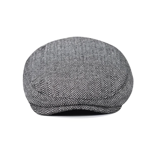 Classic herringbone flat cap for men with a grey textured tweed pattern in minimalist style