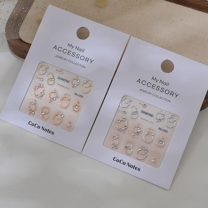 Kit d'accessoires à ongles avec anneaux or et argent, perles et strass sur cartes