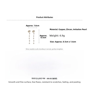 Detail view of pearl tassel earrings with dimensions 8.5cm by 1.6cm and zircon accents