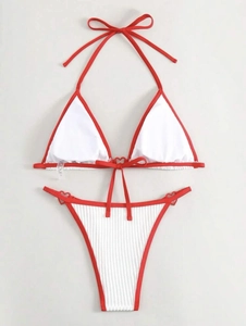 Close-up of ribbed fabric texture and contrast binding on red and white bikini set