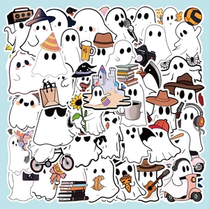 Flat lay macro of diverse cute cartoon ghost stickers for laptop decoration