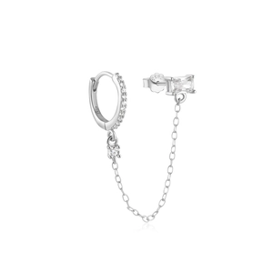 Macro detail of S925 sterling silver chain earrings with sparkling cubic zirconia