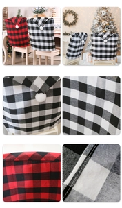 Detail of red and black buffalo plaid chair covers with festive white pom pom accents