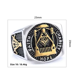 Macro detail of Freemasonry ring showing gold engravings for Faith, Hope, and Charity