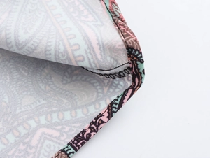 Close-up of paisley print fabric showing high-quality stitching and texture details