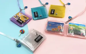 Detail of glitter PVC card holders in five colors with snap closure and lanyards