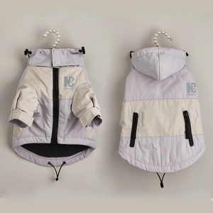 Detailed view of tricolor winter dog hoodie with zipper pockets and inner fleece texture