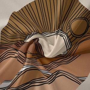 Detail of lightweight fabric featuring abstract bohemian geometric patterns in earthy tones
