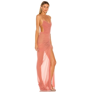 Detail of coral pink mesh maxi dress featuring side cut-outs and a high leg slit