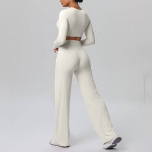 Detail of off-white long sleeve crop top and high waist wide leg yoga pants set