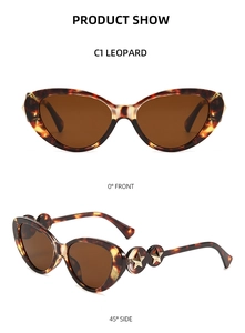 Detailed front and side views of leopard cat-eye sunglasses with gold star hardware