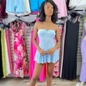 Detail view of light blue corset dress with pleated skirt and strapless design