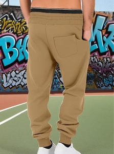 Rear view of khaki joggers featuring elastic waistband and back pocket detail