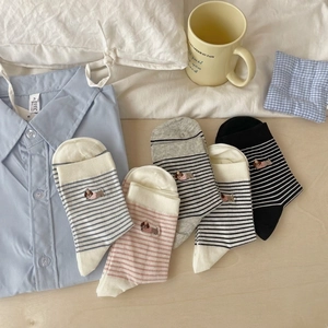 Five pairs of cotton crew socks with striped patterns and cute dog embroidery details