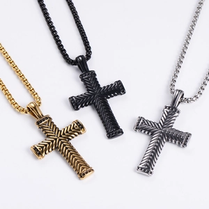 Vintage stainless steel Christian cross necklaces in gold, black, and silver finishes