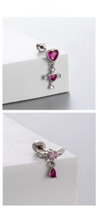 Detail of silver steel cartilage studs with pink zircon hearts and angel wing charms