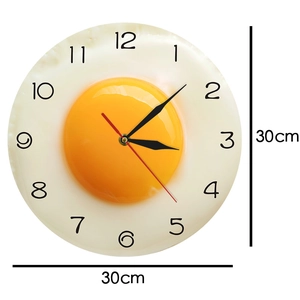 Detail view showing the 30cm diameter measurements of the fried egg kitchen wall clock
