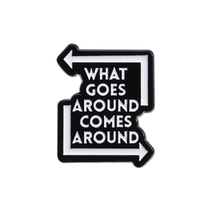 Classic black and white enamel pin with What Goes Around Comes Around quote