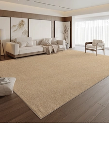 Close-up of woven texture on brown-yellow minimalist rug over modern wooden flooring