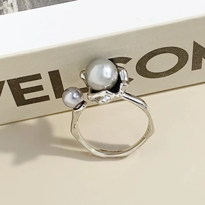 Elegant S925 sterling silver open ring with irregular pearls and a natural textured finish