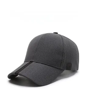 Detailed view of dark grey baseball cap showing twill texture and decorative brim strap