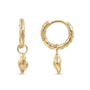 Close-up of golden seashell pendant hoop earrings with sparkling cubic zirconia inlay