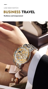 Close-up of a luxury two-tone stainless steel men's watch worn with a business suit