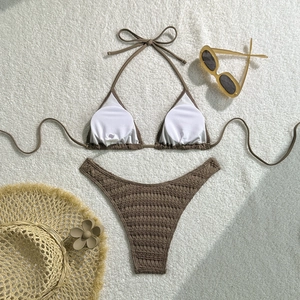 Detailed close-up of chocolate brown bikini with waffle texture and white removable pads