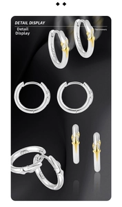 Macro view of S925 sterling silver hoop earring with gold star design detail