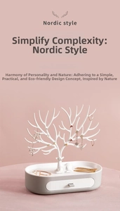 Macro detail of Nordic white antler jewelry rack with gray storage drawer base