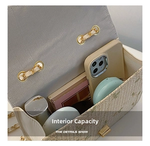 Detail showing the internal capacity of the straw crossbody bag with floral embroidery