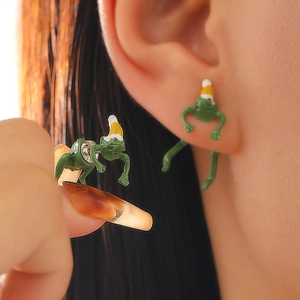 Whimsical green frog earrings with yellow Christmas hat in creative 3D climbing design