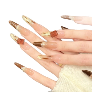 Brown gradient press-on nails with 3D amber resin diamonds and gold foil accents