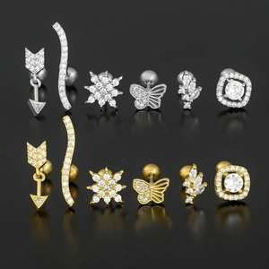 Set of 12 geometric cubic zirconia stud earrings in gold and silver butterfly designs