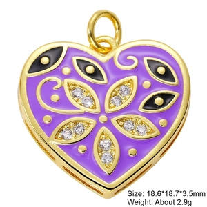 Macro detail of a purple enamel heart charm with gold edging and sparkling zircon eye