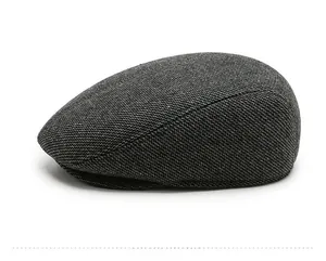 Side view of dark grey textured wool blend flat cap with ear protection for men