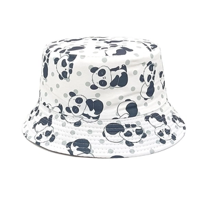 Detailed view of kids white bucket hat featuring cute panda and gray polka dot patterns