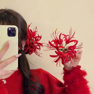 Elegant red spider lily hair clip for Chinese New Year styling and festive hair decor