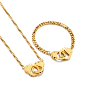 Golden handcuff jewelry set with Cuban link necklace and matching bracelet for couples