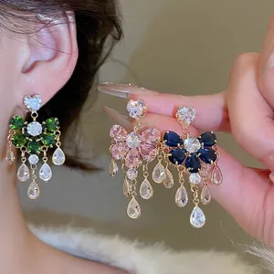 Sparkling zircon tassel earrings in floral design featuring green, pink, and blue crystals