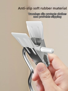 Close-up of stainless steel clothes peg with white anti-slip rubber pads for non-marking grip