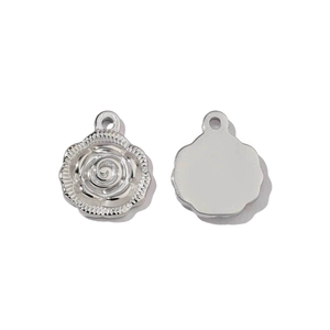 Polished silver stainless steel rose pendant detail showing both front and back sides