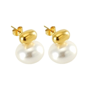 Macro detail of French vintage pearl earrings with 18K gold-plated butterfly backs