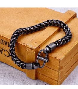 Macro shot of men's vintage gunmetal chain bracelet with industrial T-bar clasp
