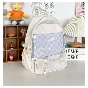 Detail view of cream white backpack with clear window pocket and white chain decor
