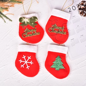 Set of 4 Christmas mini stockings with golden hangers and festive holiday patterns