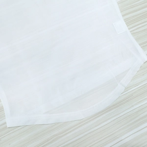 Detailed macro view showing the breathable white polyester mesh fabric and neat edge stitching