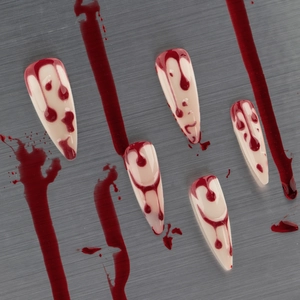 Halloween 3D long almond fake nails with realistic red blood drip patterns on nude base