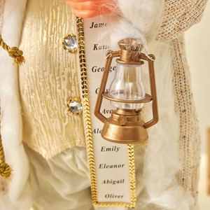 Statuina di Babbo Natale bianco e oro con lanterna in bronzo e pergamena dei nomi