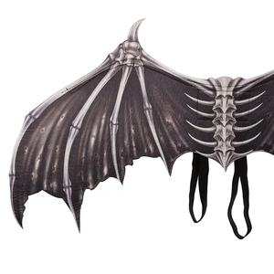 Close-up of foldable bone-shaped wings with realistic texture and elastic shoulder straps